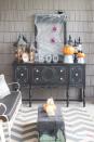 <p>This spooky setup, fashioned from a thrifted dresser, is the perfect spot to serve treats to kiddos and cocktails to grown-ups.</p><p><strong>Get the tutorial at <a href="https://www.attagirlsays.com/scary-halloween-decorations-for-the-front-porch/" rel="nofollow noopener" target="_blank" data-ylk="slk:Atta Girl Says;elm:context_link;itc:0;sec:content-canvas" class="link ">Atta Girl Says</a>.</strong> </p>