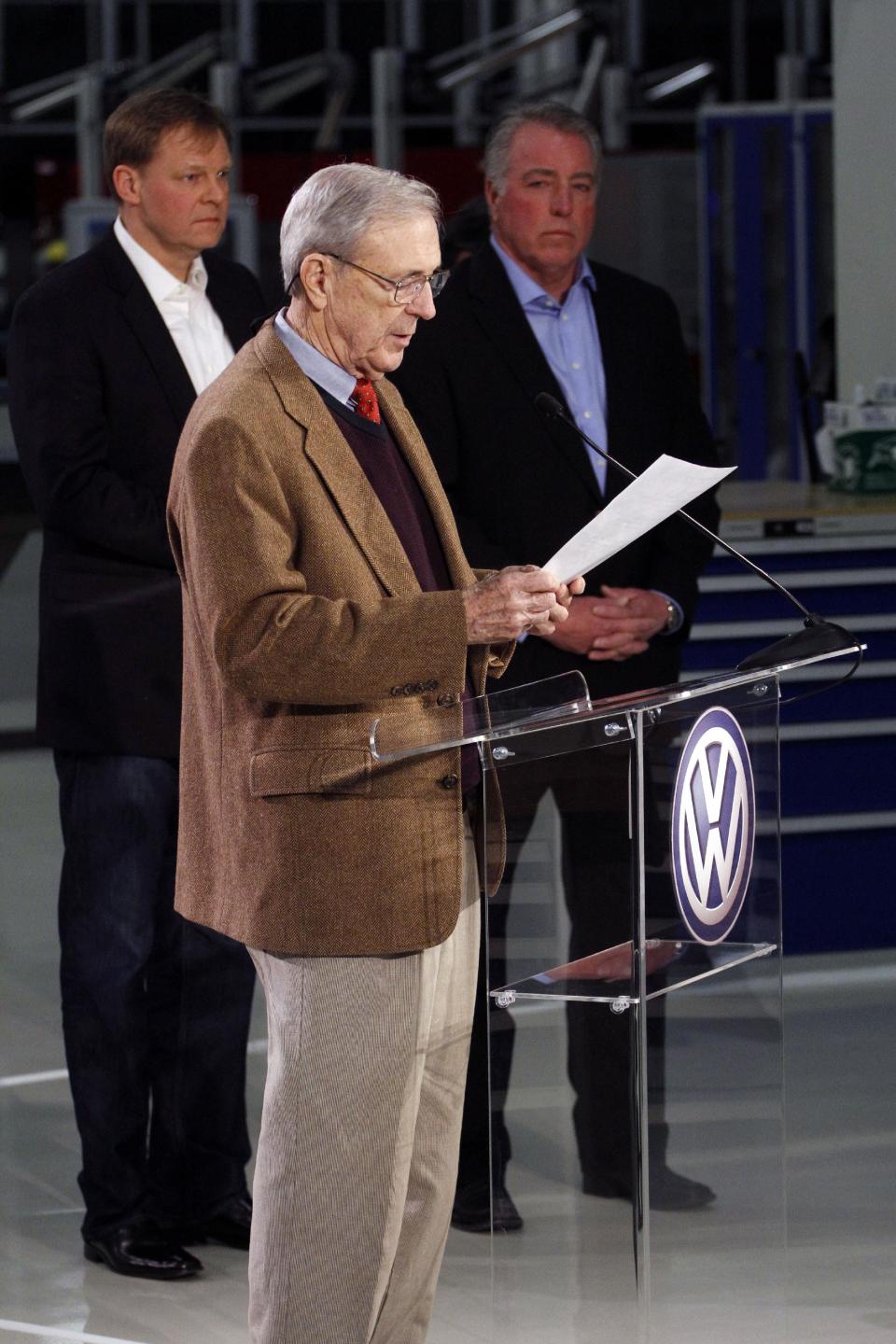 Retired circuit judge Sam Payne, foreground, announces that Volkswagen employees voted to deny representation by the United Auto Workers union as Frank Fischer, Chairman and CEO of the Volkswagen Group of America, left, and Gary Casteel, UAW Region 8 Director, look on from behind, concluding a three day election which ended this evening Friday, Feb. 14, 2014, in Chattanooga, Tenn. (AP Photo/Chattanooga Times Free Press, Dan Henry) THE DAILY CITIZEN OUT; NOOGA.COM OUT; CLEVELAND DAILY BANNER OUT; LOCAL INTERNET OUT
