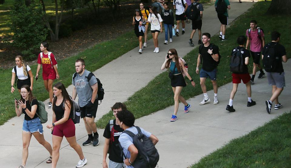 Iowa State University students walk to class on the first day of the new school year Monday, Aug. 21, 2023, in Ames, Iowa.