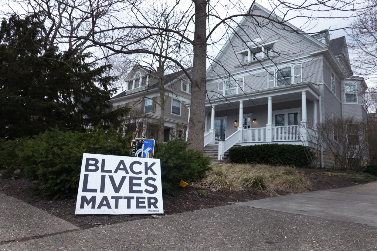 A Black Lives Matter sign sits in front of a home on March 23, 2021 in Evanston, Illinois. The City Council of Evanston voted yesterday to approve a plan, which may be the first of its kind in the nation, to make reparations available to Black residents due to past discrimination. (Photo by Scott Olson/Getty Images)