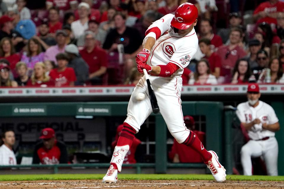 Cincinnati Reds first baseman Joey Votto (19) hits a single in the sixth inning during a baseball game against the St. Louis Cardinals, Friday, April 22, 2022, at Great American Ball Park in Cincinnati. 