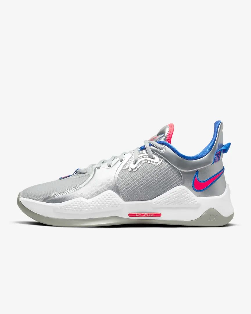 Silver and white Nike basketball shoe