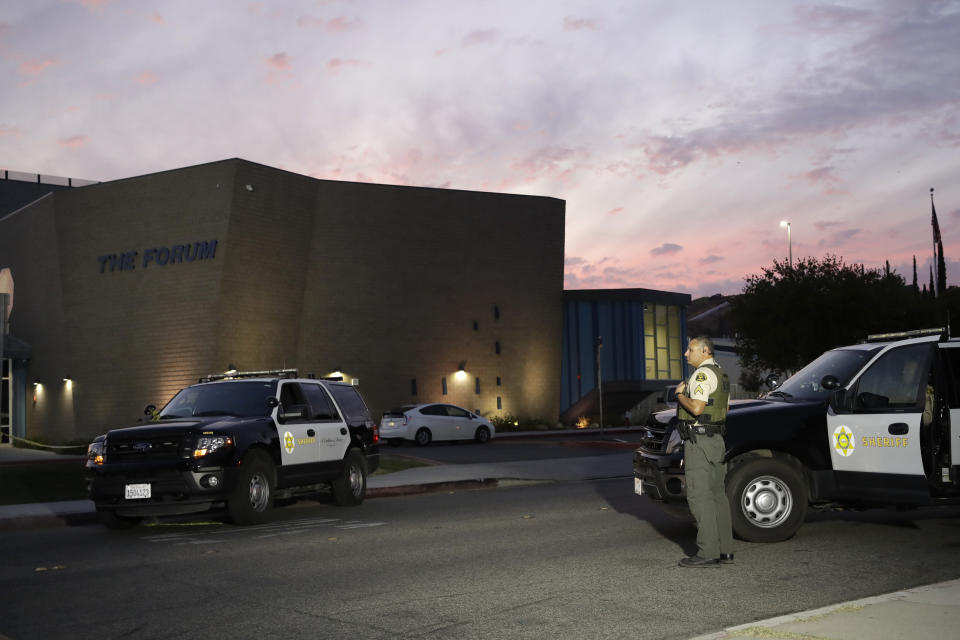 A member of the Los Angeles County Sheriff Department outside of Saugus High School in the aftermath of a shooting on Thursday, Nov. 14, 2019, in Santa Clarita, Calif. (AP Photo/Marcio Jose Sanchez)