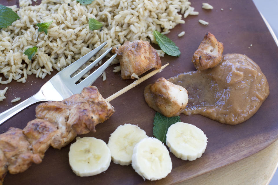 In this Aug. 5, 2013 photo, chicken kebabs with chili banana sauce are shown, in Concord, N.H. (AP Photo/Matthew Mead)