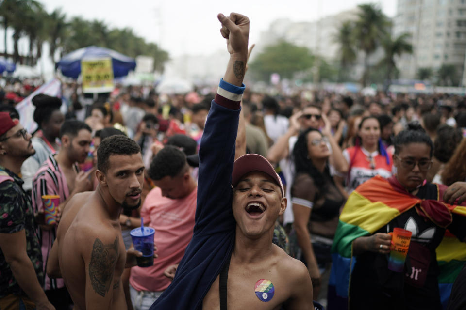 A man cheers during the annual gay pride parade along Copacabana beach in Rio de Janeiro, Brazil, Sunday, Sept. 22, 2019. The 24th gay pride parade titled this year's parade: "For democracy, freedom and rights, yesterday, today and forever." (AP Photo/Leo Correa)