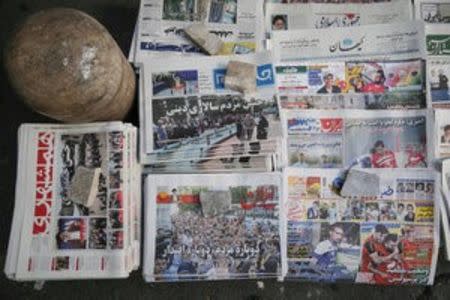 Newspapers featuring presidential election news are seen in Tehran, Iran, May 20, 2017. TIMA via REUTERS ATTENTION EDITORS - THIS IMAGE WAS PROVIDED BY A THIRD PARTY. FOR EDITORIAL USE ONLY. NO RESALES. NO ARCHIVES.