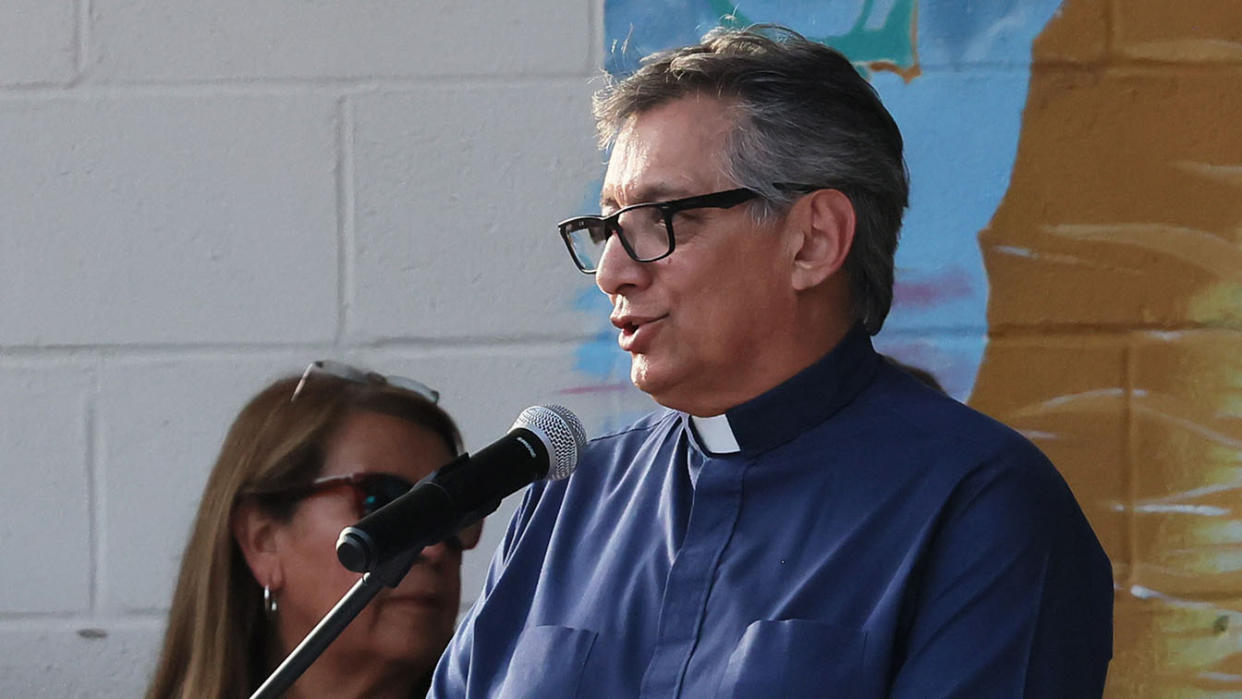 The Rev. Eduardo Morales at a vigil for the victims.
