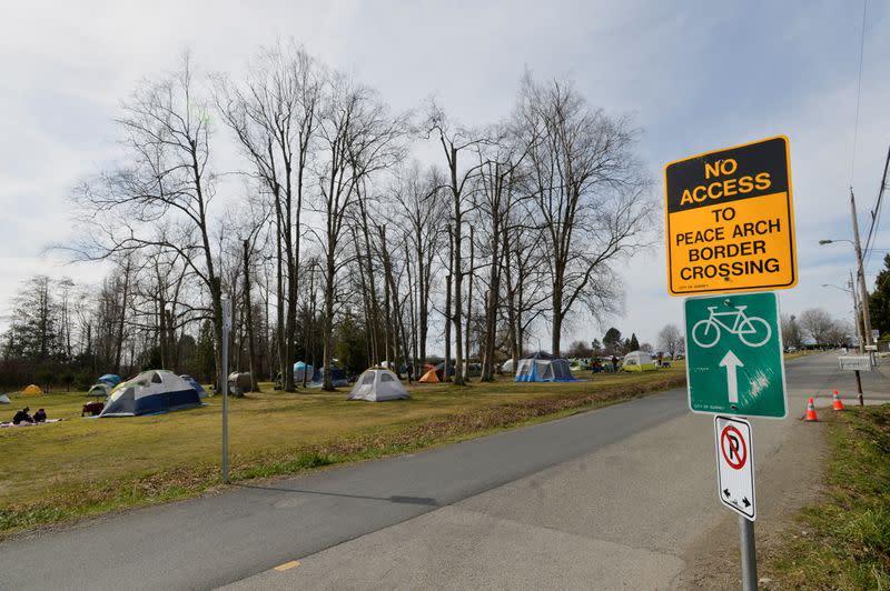 FILE PHOTO: Canadians and Americans meet on the border south of Vancouver