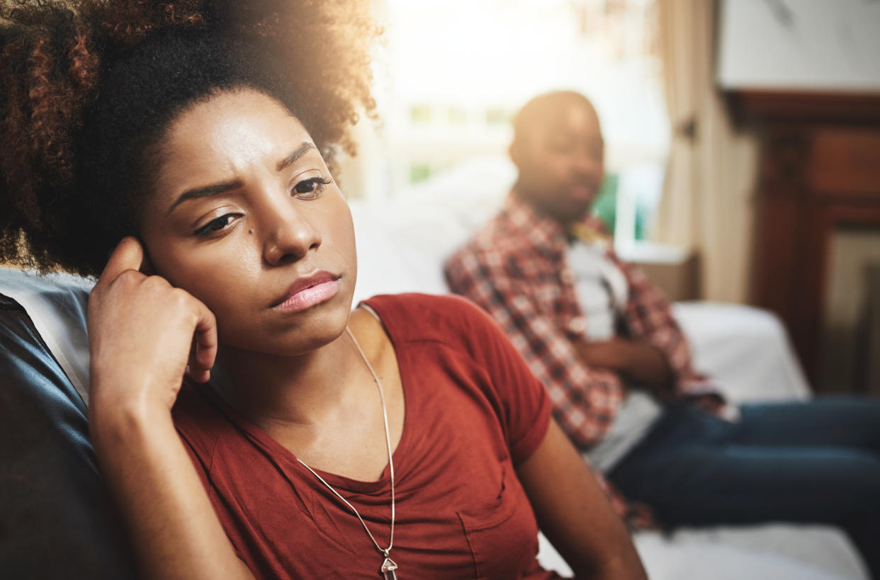 Cropped shot of a young woman giving her boyfriend the silent treatment after a fight