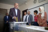 Turkey's President Recep Tayyip Erdogan casts his ballot at a polling station in Istanbul, Sunday, June 23, 2019. Polls have opened in a repeat election in Turkey's largest city where Erdogan and his political allies could lose control of Istanbul's administration for the first time in 25 years. (AP Photo/Emrah Gurel)