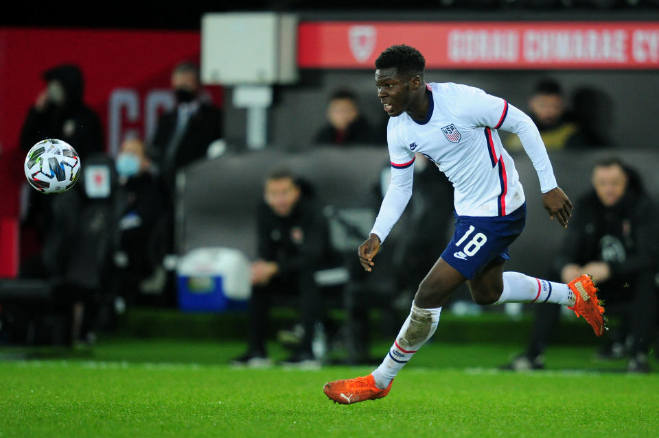 USMNT midfielder Yunus Musah goes for the ball during an international friendly against Wales. 