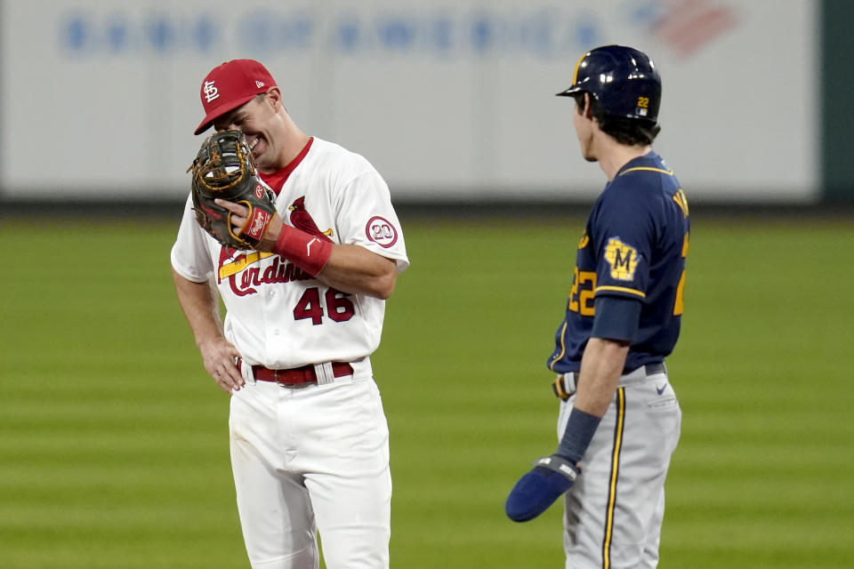 St. Louis Cardinals first baseman Paul Goldschmidt (46) laughs as he talks with Milwaukee Brewers' Christian Yelich during a pause in the action in the fifth inning of a baseball game Thursday, Sept. 24, 2020, in St. Louis. (AP Photo/Jeff Roberson)