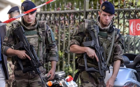 Military officers set up a security perimeter near the site - Credit: EPA/CHRISTOPHE PETIT TESSON