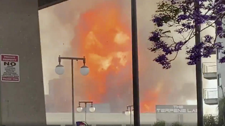 In this screen grab from video provided by Sean Miura, flames from an explosion are seen Saturday, May 16, 2020, in Los Angeles. (Sean Miura via AP)