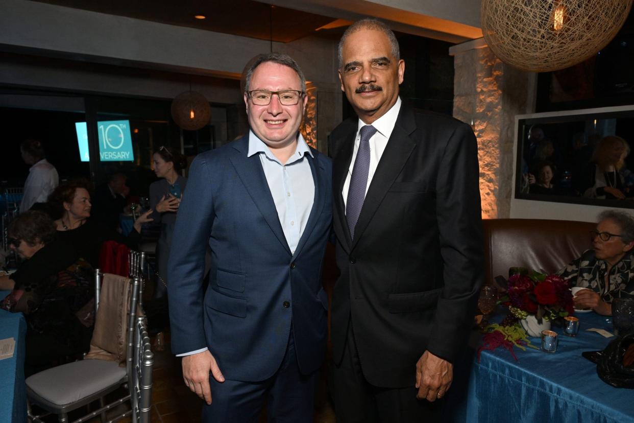 Eric Holder, right, with Alexander Vindman