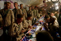 <p>U.S. Marines, from the 24th Marine Expeditionary Unit, have a special lunch to celebrate the Fourth of July at a forward operating base in southern Afghanistan, Friday, July 4, 2008. (Photo: Rafiq Maqbool/AP) </p>