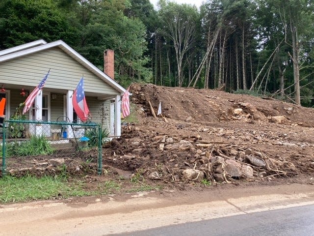 The home of Theresa "Tess" and Franklin McKenzie seen here Aug. 20 across the river from the Laurel Bank Campground in Cruso, which was devastated by the flooding. Tess said her husband was killed in the flooding.