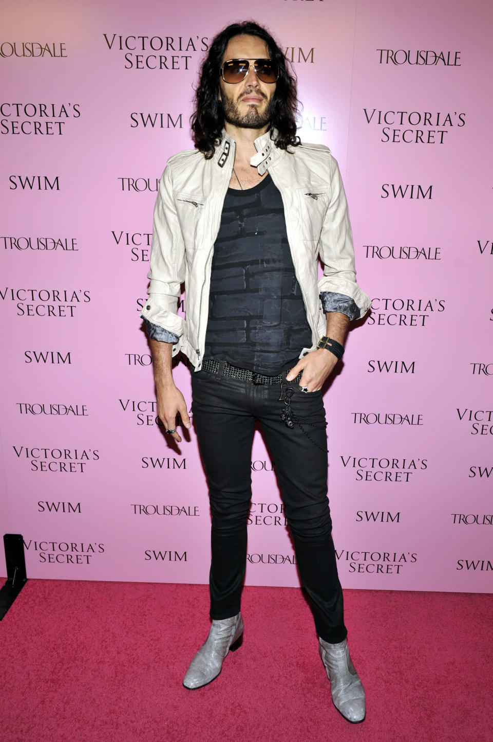 Russell Brand in boots with a chunky heel