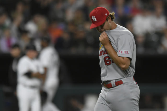 Luis Robert Jr. #88 of the Chicago White Sox reacts after hitting