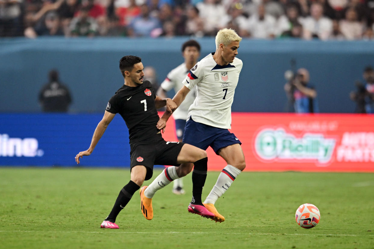LAS VEGAS, NEVADA - JUNE 18: Gio Reyna #7 of the United States holds off Stephen Eustaquio #7 of Canada during the 2023 CONCACAF Nations League Final at Allegiant Stadium on June 18, 2023 in Las Vegas, Nevada. (Photo by Candice Ward/USSF/Getty Images for USSF)