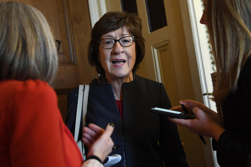 In this Jan. 15, 2020, photo, Sen. Susan Collins, R-Maine, talks to reporters on Capitol Hill in Washington. In the dawn of what may be her toughest reelection fight, veteran Collins has parachuted into familiar terrain _ the pressure-packed middle of an issue, this time the impeachment of President Donald Trump. (AP Photo/Susan Walsh)