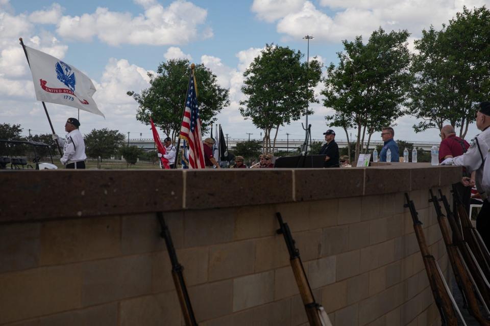 Flags representing each branch of the military are presented at a ground breaking ceremony for an expansion of the Coastal Bend State Veterans Cemetery on Friday, Sept. 22, 2023, in Corpus Christi, Texas.