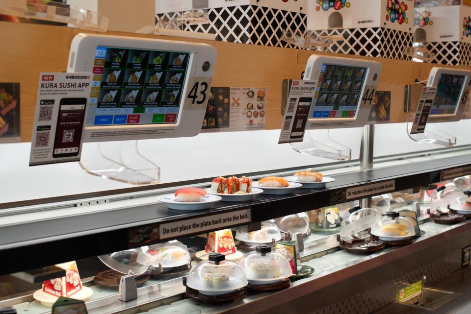 Ventilated sushi lids limit airborne exposure, and plate-tracking technology monitors how long a plate has been circulating.