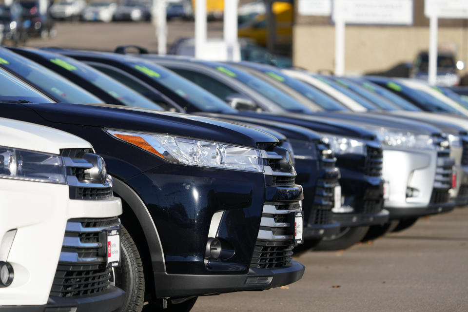 This Nov. 15, 2020 photo shows a long row of unsold used Highlander sports-utility vehicles sits at a Toyota dealership in Englewood, Colo. In 2021, high demand and low supply have driven up used vehicle prices so much that many are now selling for more than their original sticker price when they were new. (AP Photo/David Zalubowski)