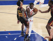 New York Knicks forward Julius Randle (30) drives against Atlanta Hawks forward John Collins (20) during the third quarter of an NBA basketball game Wednesday, April 21, 2021, in New York. (Wendell Cruz/Pool Photo via AP)