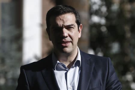 Greek Prime Minister Alexis Tsipras exits the Presidential palace after attending a dinner hosted by outgoing Greek President Karolos Papoulias, in honour of newly-elected President Prokopis Pavlopoulos, in Athens, March 4, 2015. REUTERS/Alkis Konstantinidis