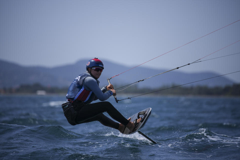 FILE - U.S. Olympic sailing team member Daniela Moroz kiteboards during a training session in Hyeres, southern France, Monday, April 29, 2024. The fastest sport at the Paris Games has such wild speeds that the athletes say the waves and the wind become muted. (AP Photo/Daniel Cole, File)