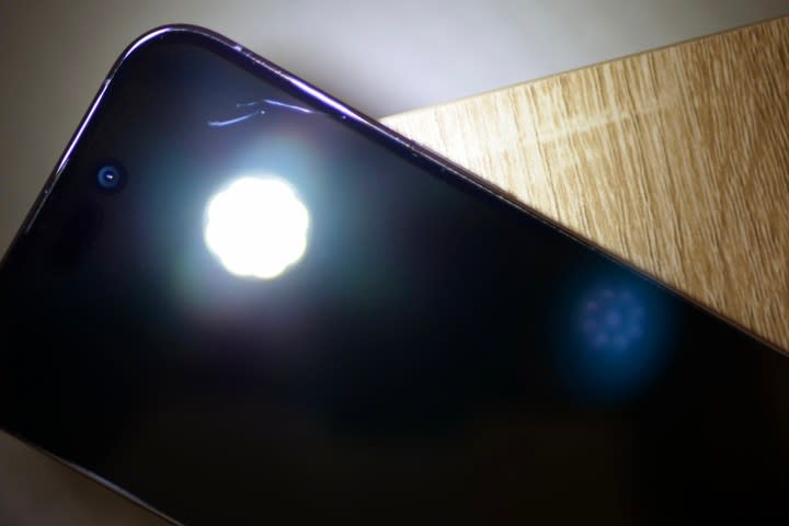 Ceramic Shield on the iPhone 14 Pro, with light to show scratches.