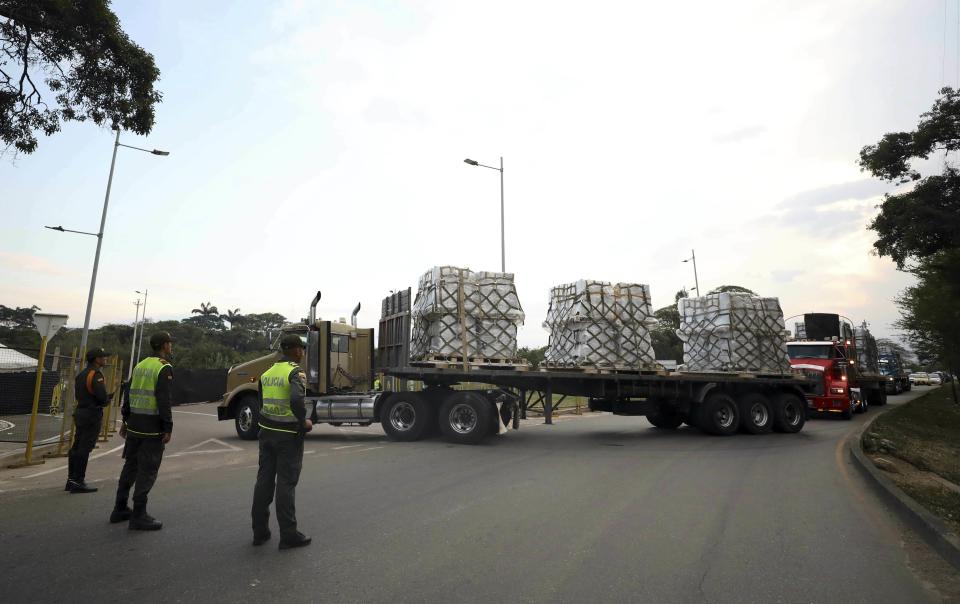 Trucks loaded with USAID humanitarian aid for Venezuela are escorted by police as they arrive at the Tienditas International Bridge in Cucuta, Colombia, on the border with Venezuela, Saturday, Feb. 16, 2019. The U.S. military airlifted tons of humanitarian aid as part of an effort meant to undermine socialist President Nicolas Maduro and back his rival for the leadership of the South American nation. (AP Photo/Fernando Vergara)