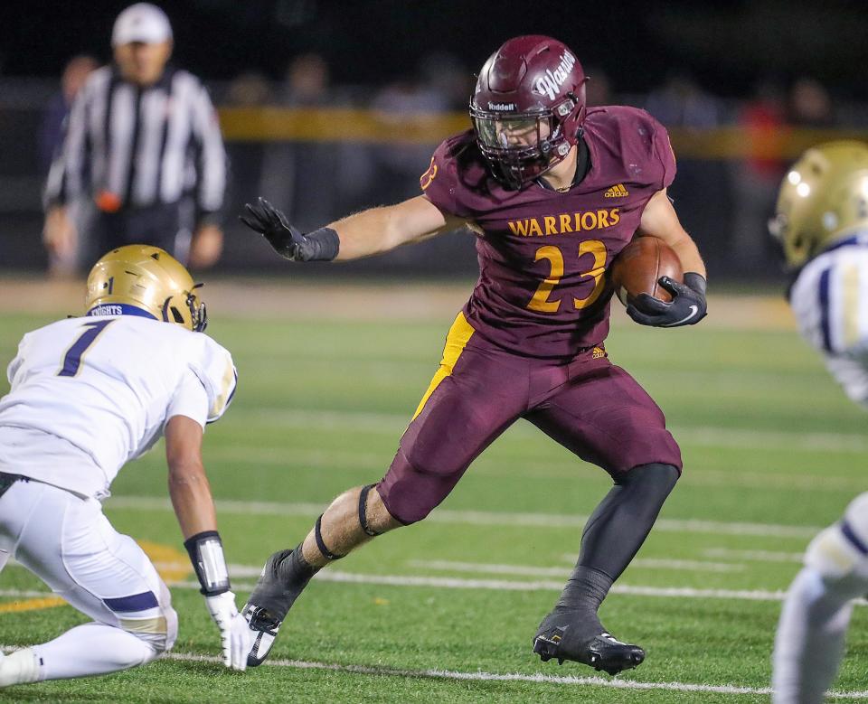 Walsh Jesuit's running back Justin Bremmer puts a move on Hoban's Tysen Campbell during a third quarter run on Friday, Sept. 23, 2022 in Cuyahoga Falls.