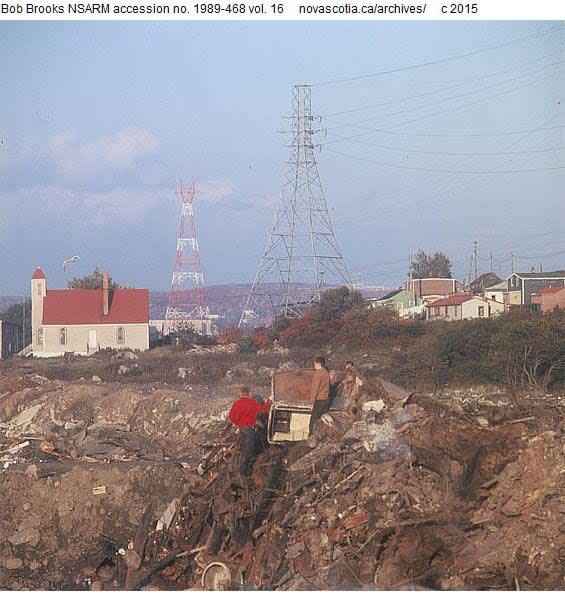 Halifax city dump with Seaview African United Baptist Church and Africville houses in the background