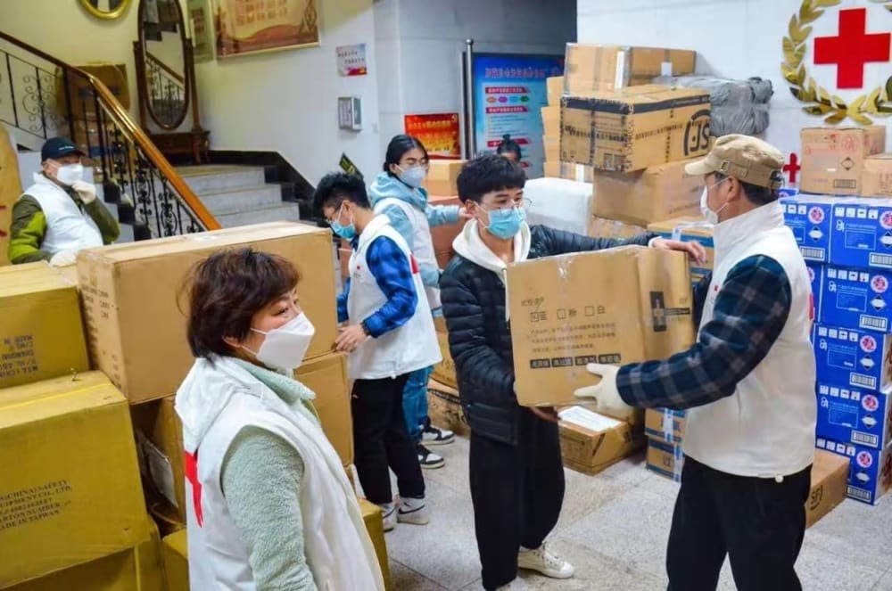 Singapore Red Cross volunteers delivering humanitarian aid to communities in China affected by the Wuhan coronavirus outbreak. (PHOTO: Singapore Red Cross)