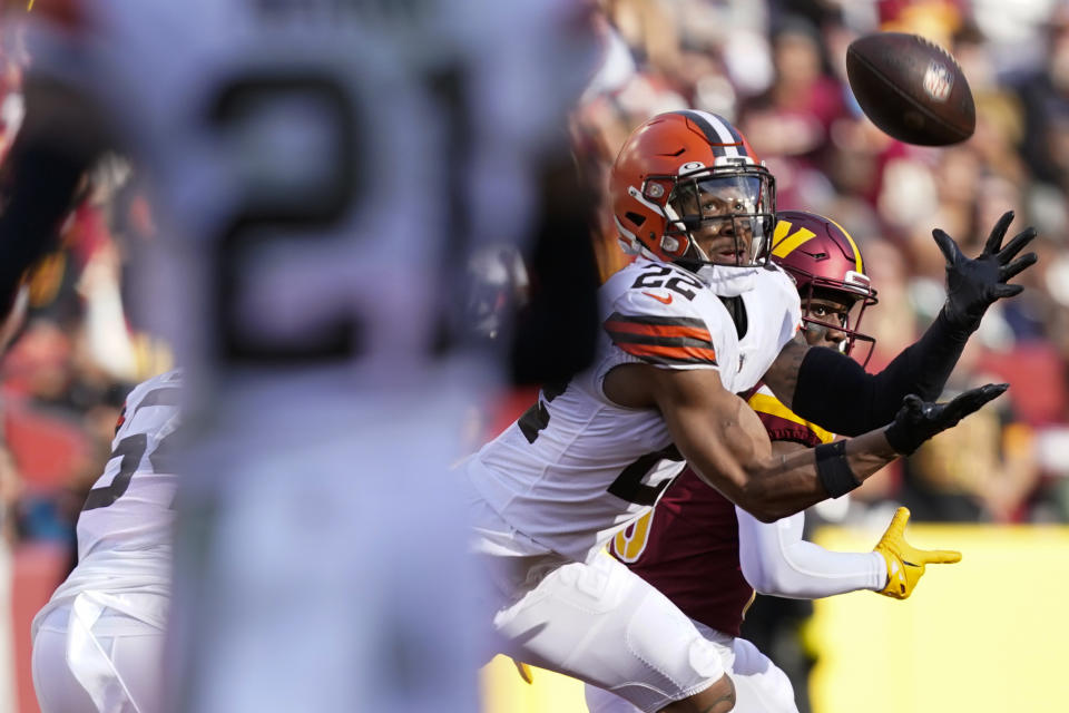 Cleveland Browns safety Grant Delpit (22) intercepts a pass thrown by Washington Commanders quarterback Carson Wentz during the first half of an NFL football game, Sunday, Jan. 1, 2023, in Landover, Md. (AP Photo/Patrick Semansky)