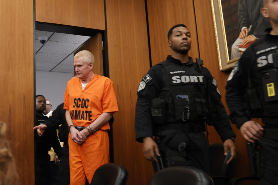 Alex Murdaugh, convicted of killing his wife, Maggie, and younger son, Paul, in June 2021, is escorted into the courtroom before a hearing on a motion for a retrial, Tuesday, Jan. 16, 2024, at the Richland County Judicial Center in Columbia, S.C. (Tracy Glantz/The State via AP, Pool)