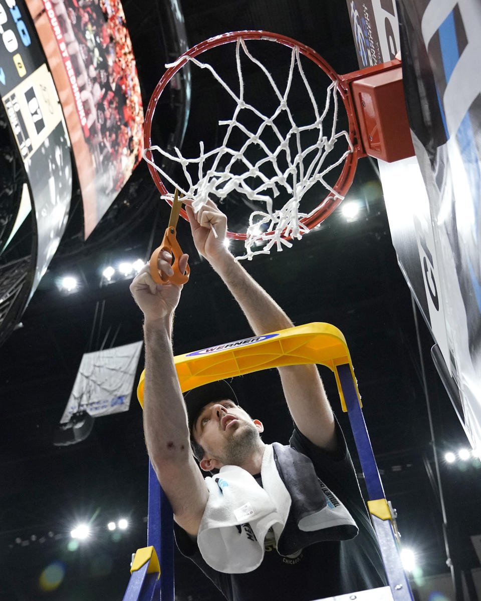 Purdue's Trey Kaufman-Renn cuts the net after his team's 67-65 win over Penn State to claim the Big Ten tournament championship in an NCAA college basketball game Sunday, March 12, 2023, in Chicago. (AP Photo/Erin Hooley)