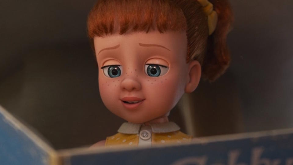 Gabby Gabby reads a book in Toy Story 4