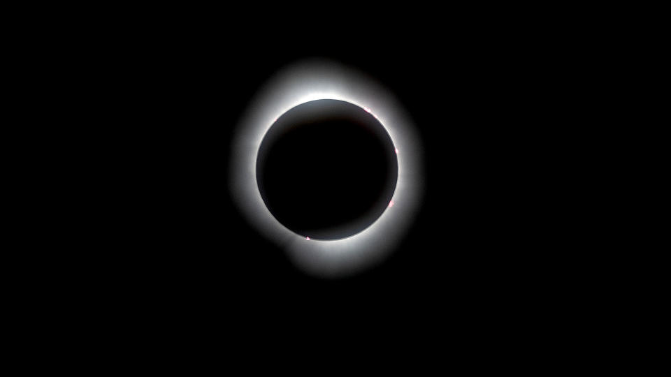 The moon eclipses the sun in a total solar eclipse on April 8, 2024 as seen from SUNY Potsdam, New York.