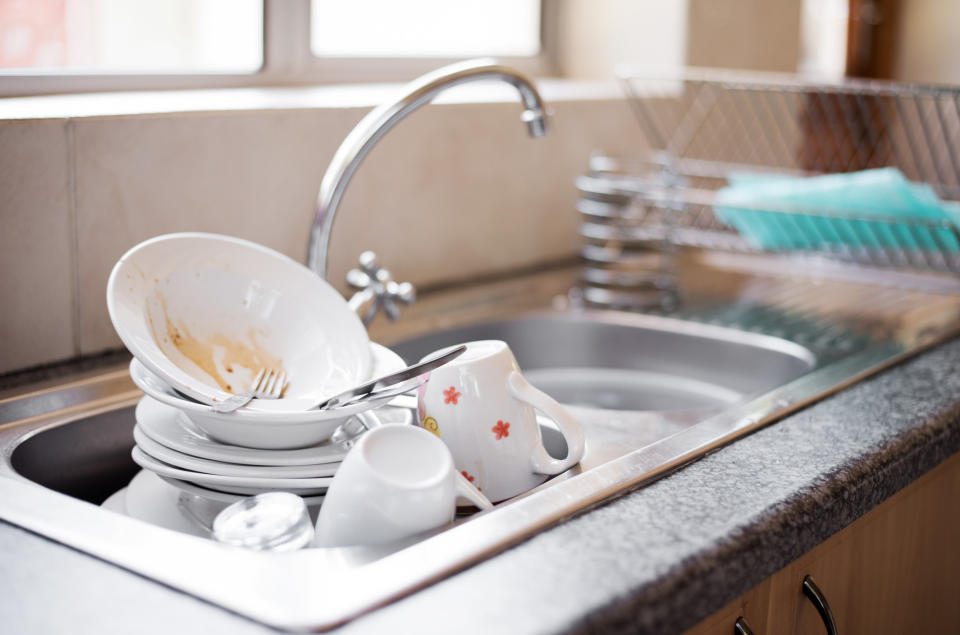 A sink full of dirty dishes