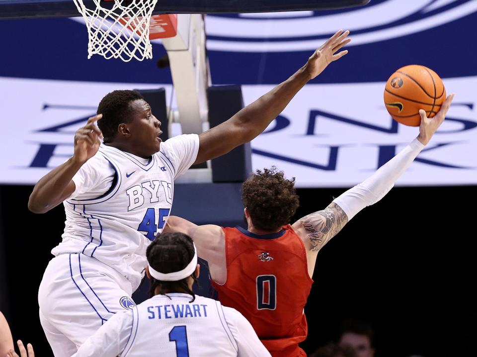 Brigham Young Cougars forward Fousseyni Traore (45) defends a shot by Saint Mary’s Gaels guard Logan Johnson (0) as BYU and Saint Mary’s play at the Marriott Center in Provo on Saturday, Jan. 28, 2023. The Gaels won 57-56.