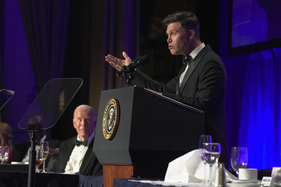 Host Colin Jost speaks at the White House Correspondents' Association Dinner at the Washington Hilton, Saturday, April 27, 2024, in Washington. Looking on at left is President Joe Biden. (AP Photo/Manuel Balce Ceneta)