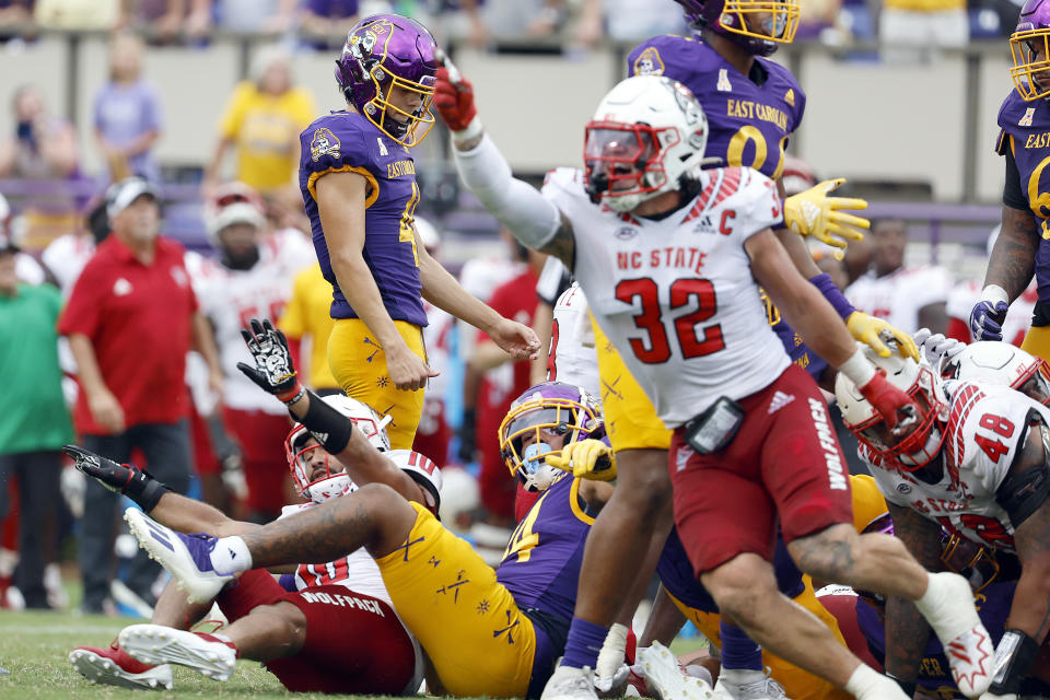 East Carolina's Owen Daffer (41), top left, react after missing a 41-yard field goal against North Carolina State during the second half of an NCAA college football game in Greenville, N.C., Saturday, Sept. 3, 2022. (AP Photo/Karl B DeBlaker)