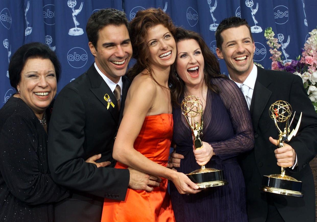 From left, Shelley Morrison, Eric McCormack, Debra Messing, Megan Mullally and Sean Hayes celebrate their awards for their work in "Will & Grace" at the 52nd Annual Primetime Emmy Awards in Los Angeles, Sunday, Sept. 10, 2000. The show garnered awards for best comedy series and best supporting actor and actress for Hayes and Mullally. (AP Photo/Kevork Djansezian)