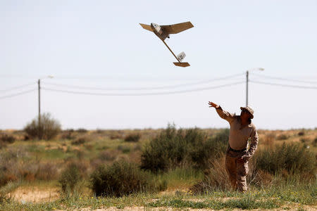 U.S. Marine operates an unmanned aerial vehicle during Juniper Cobra, a U.S.-Israeli joint air defence exercise, in Zeelim, southern Israel, March 12, 2018. Picture taken March 12, 2018. REUTERS/Amir Cohen