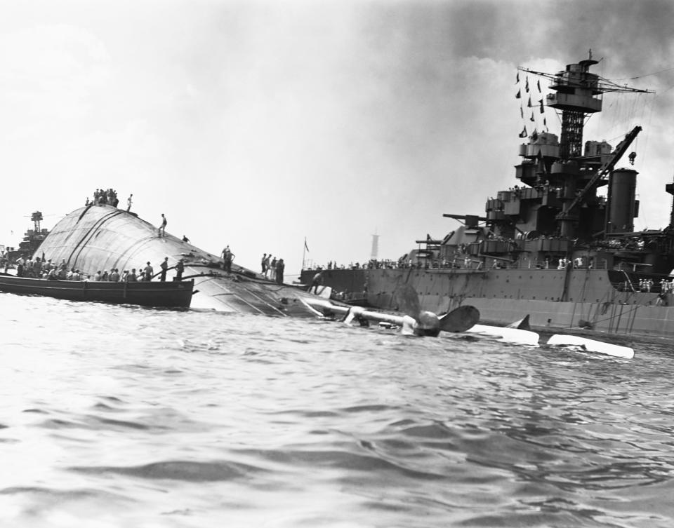 The USS Oklahoma floats capsized near the USS Maryland. The ships were destroyed during the Japanese attack on Pearl Harbor on September 7, 1941. / Credit: Â© CORBIS/Corbis via Getty Images