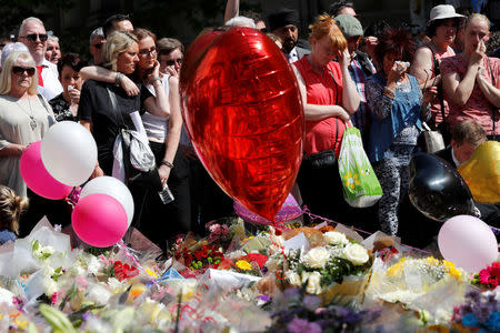 People attend a minute of silence for the victims of the Manchester Arena attack,in St Ann's Square, in central Manchester, Britain May 25, 2017. REUTERS/Stefan Wermuth