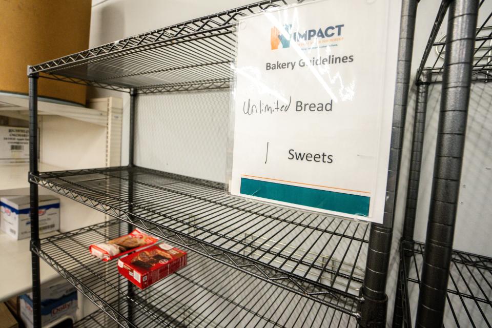 Shelves where bread and sweets would be are seen at IMPACT food pantry in the Drake neighborhood on Tuesday, August 1, 2023 in Des Moines.